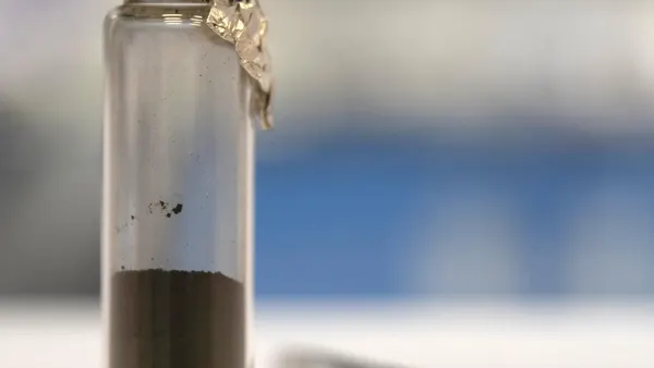 Vial holding a sample of asteroid Bennu returned by OSIRIS-REx